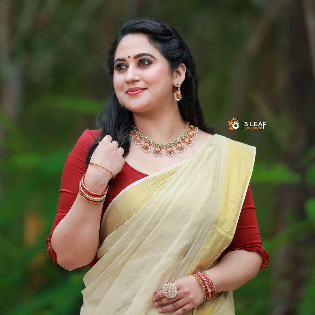 Malayalam Actress Miya George Stills in Yellow Saree Red Blouse